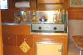 Kitchen cabinets and stainless steel countertop in restored 1948 Terry Rambler Trailer